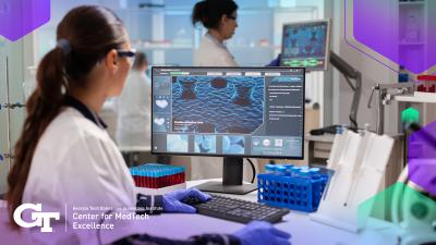 Researcher at computer in lab