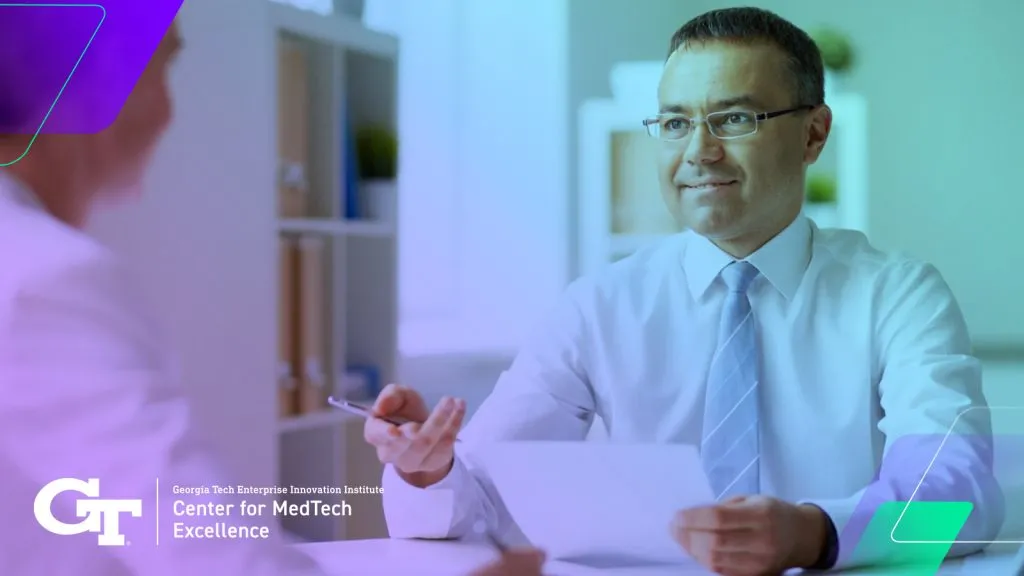 man signing contract